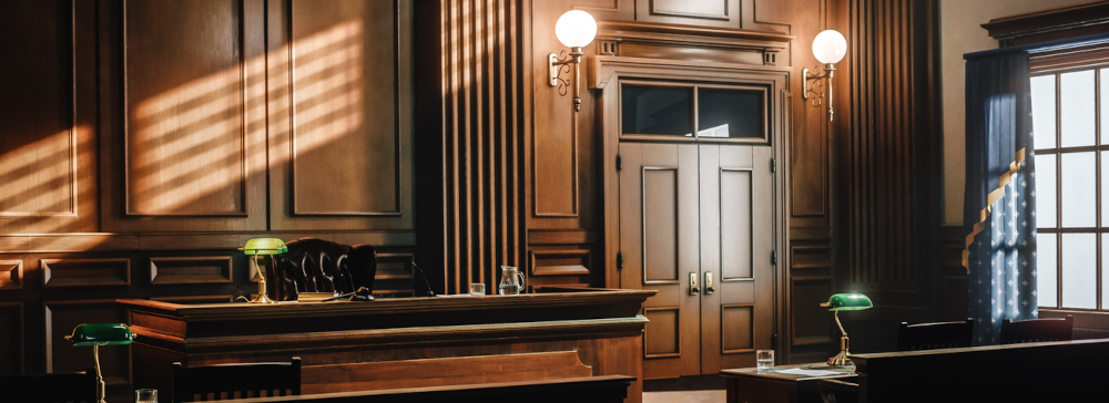 The interior of an empty wood paneled court room