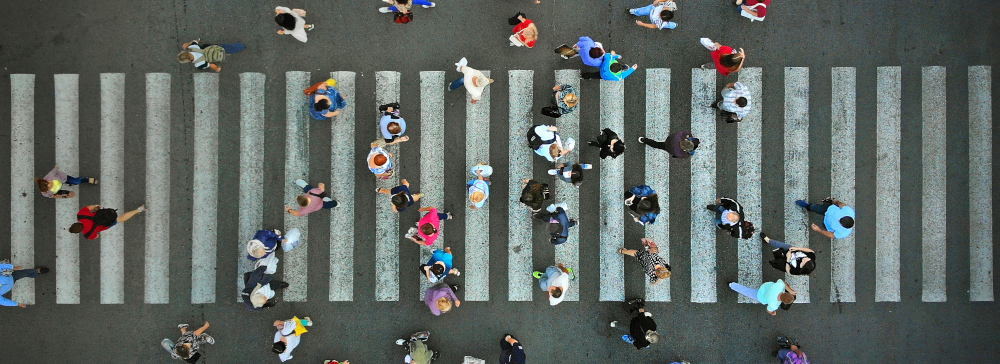Aerial view of a downtown crosswalk crowded with pedestrians