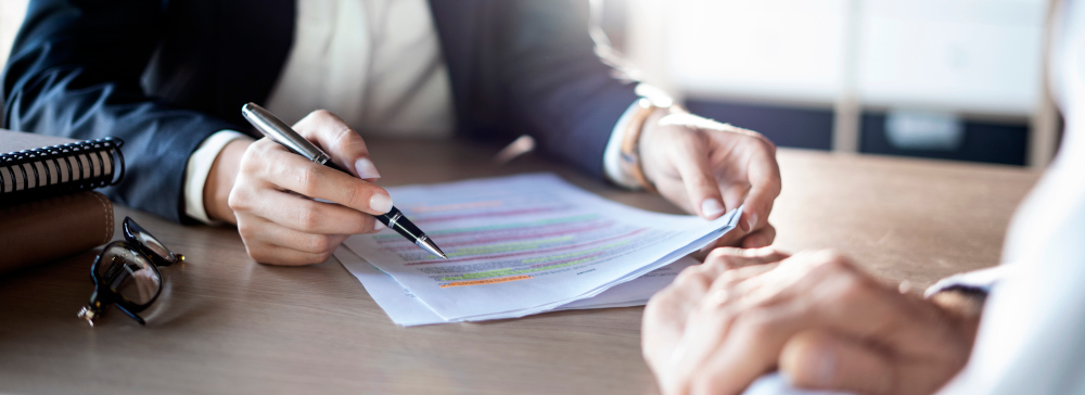 A lawyer and their client reviewing a settlement offer after an accident