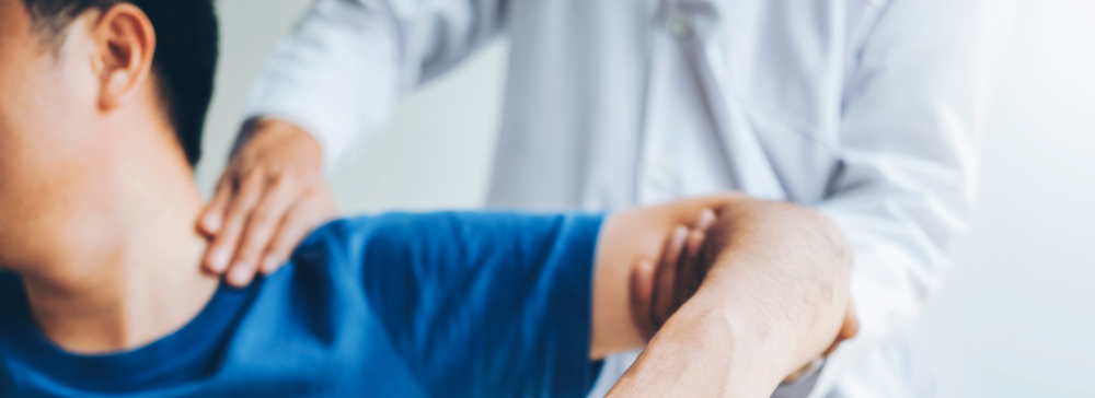 Doctor diagnosing a rotator cuff tear in a patient