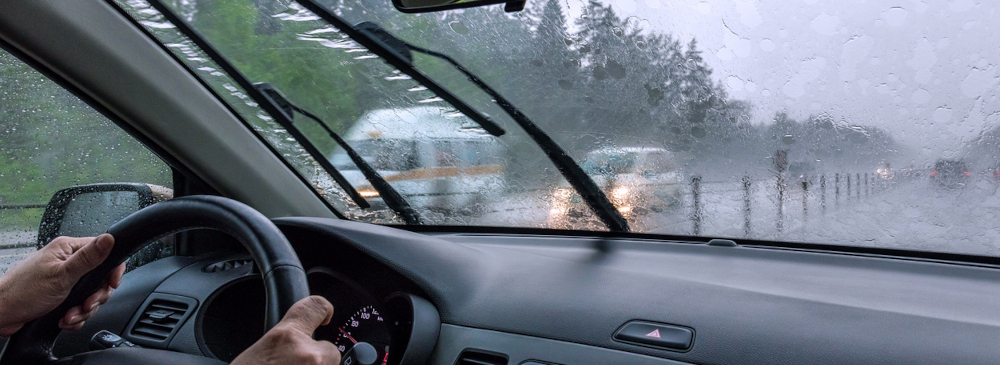 Inside view of a car driving in heavy rain