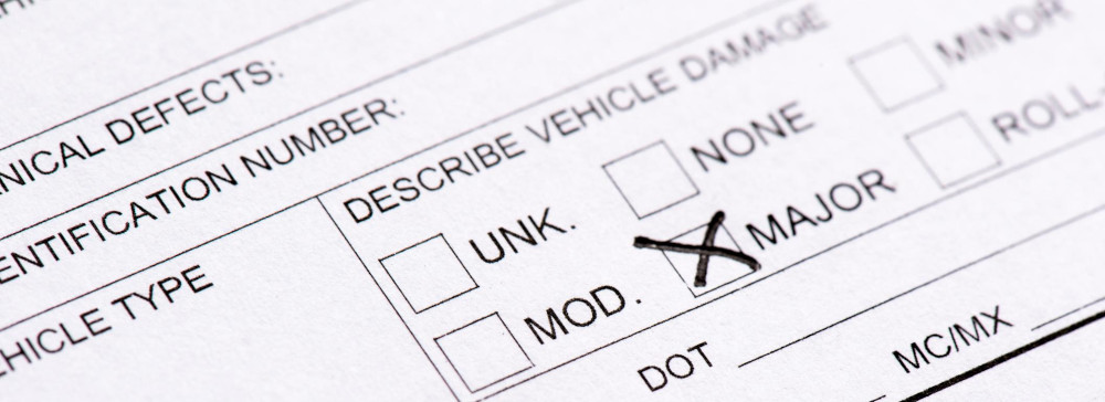 A close-up of a car accident report form from a police department