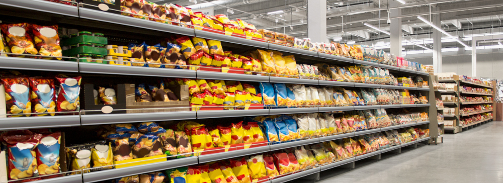 Chips and snacks on shelf at a supermarket.