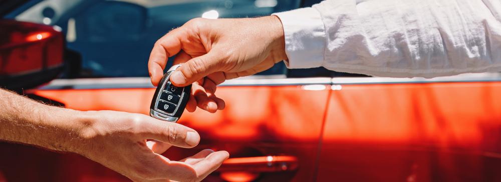 A person returning a car key to a driver after a wrongful possession