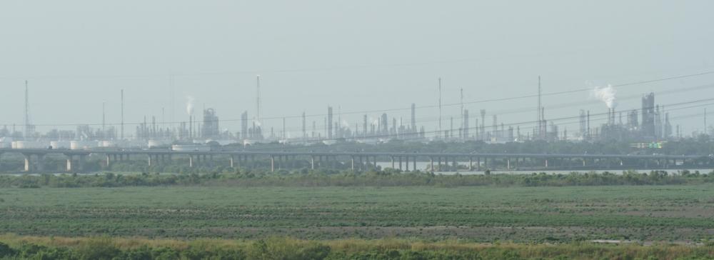 Oil refineries across a shipping channel in the Port of Houston